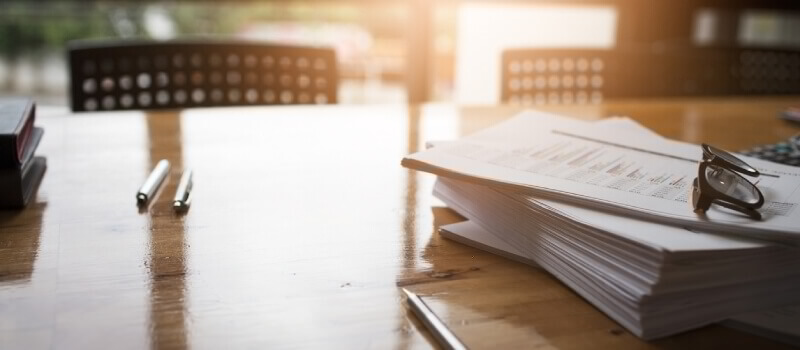 Stack of legal papers in a family law office