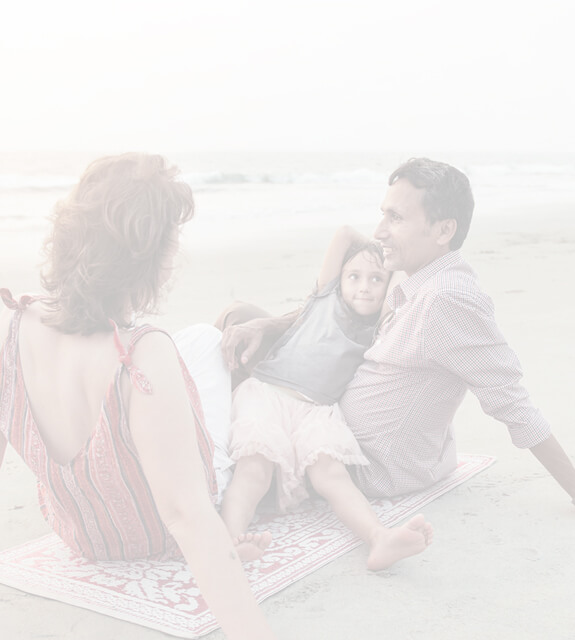 Mother father and daughter on beach