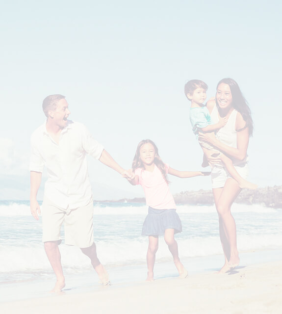 Mother father son and daugther walk on beach