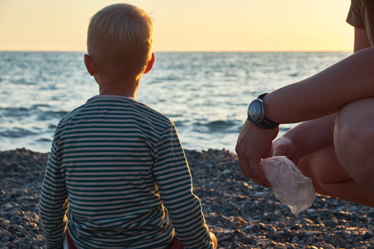 Child and parent on the beach