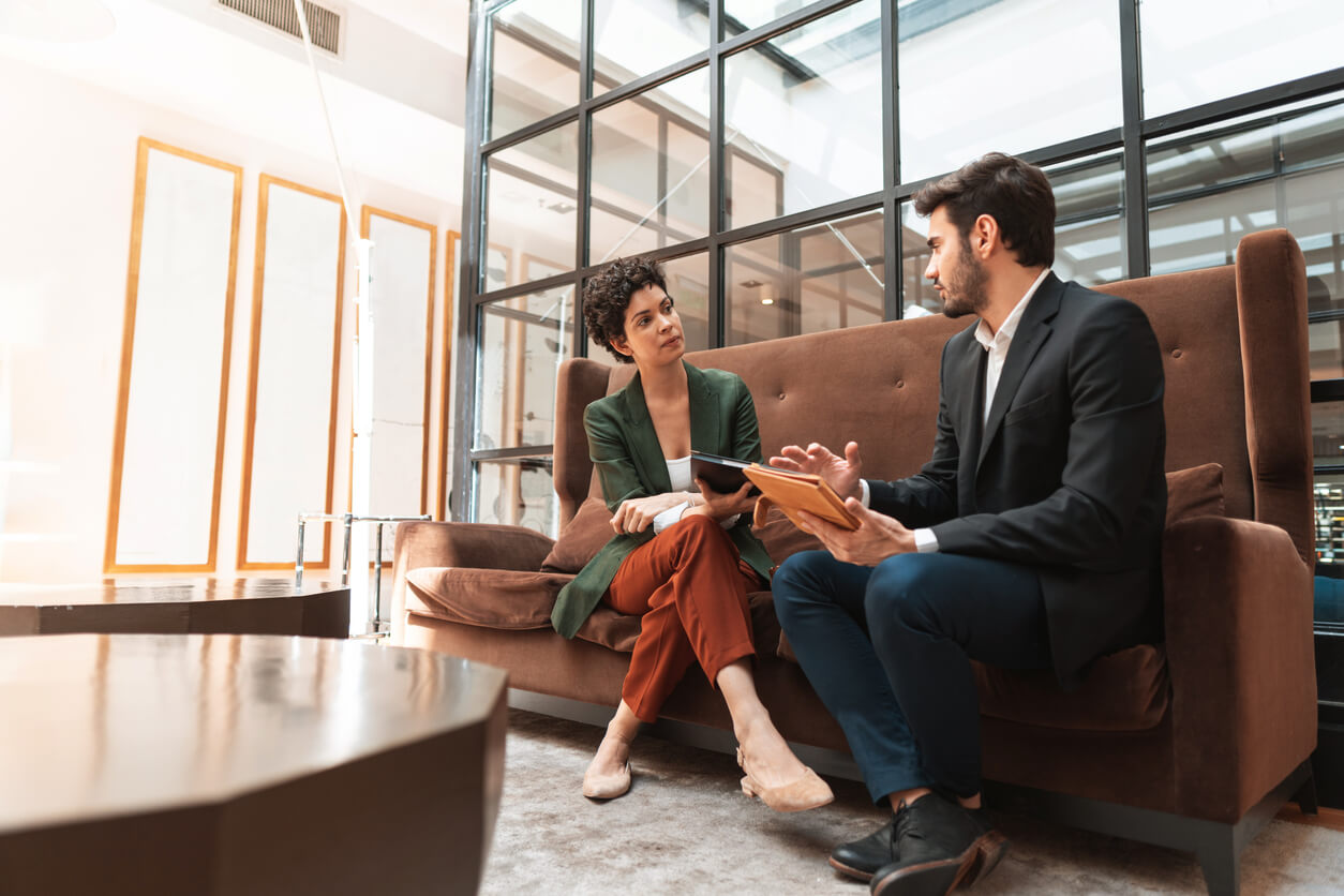 Woman sitting with her divorce attorney