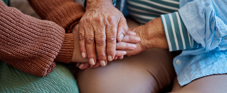 Elderly mother comforting her daughter after a divorce