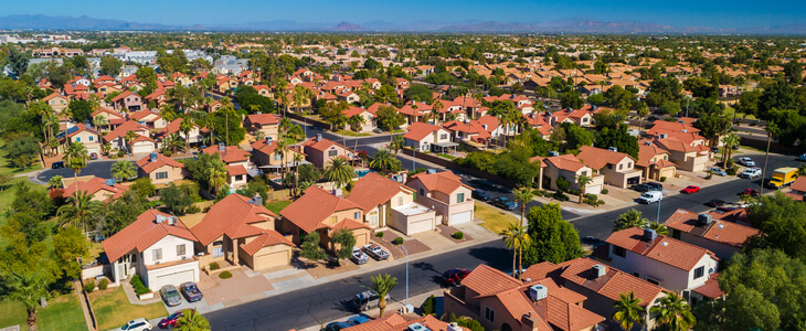 Sunny suburban neighborhood with red-colored houses in Chandler, Arizona