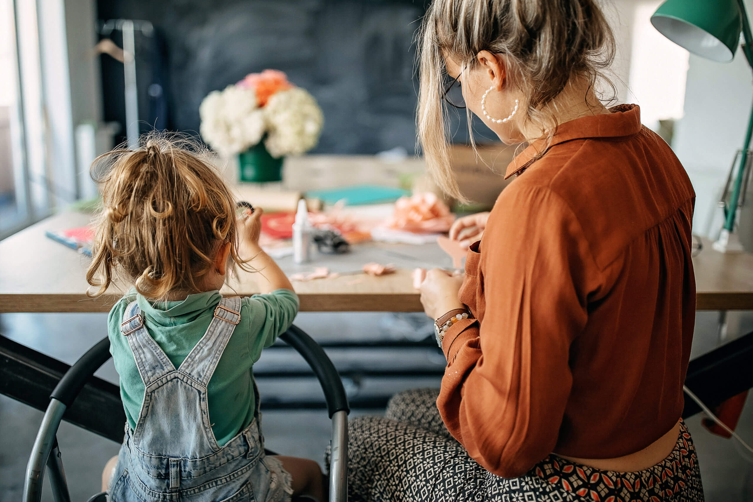 mom and daughter making crafts