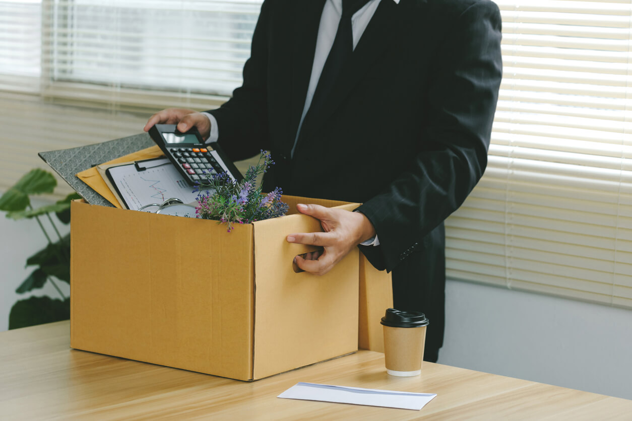 man packing work belongings