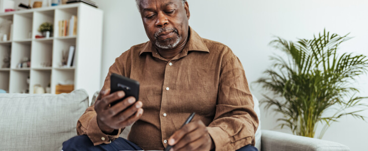 Elderly man doing his taxes.