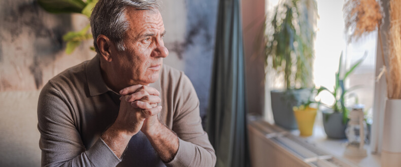 Man sitting appearing sad