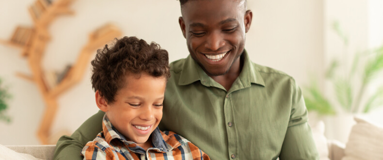 Man with step son smiling