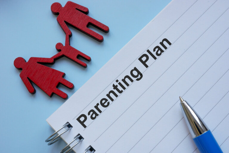 Notepad with Parenting Plan and paper cutout of family